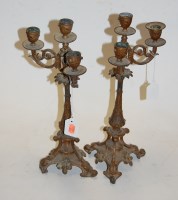 Lot 20 - A pair of Rococo style gilt metal three sconce...