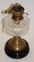 Lot 22 - An early 20th century oil lamp, having...