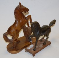 Lot 67 - A modern bronzed figure of a horse, on wooden...