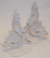 Lot 82 - A set of three carved and white painted wall...