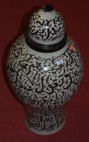 Lot 91 - A large earthenware jar and cover of baluster...