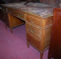 Lot 1260 - An Edwardian mahogany and tan leather inset...