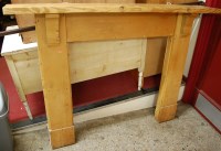 Lot 1155 - A pine round cornered fire surround of plain...