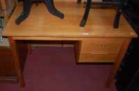 Lot 1268 - A 1970s teak writing desk, having two short...
