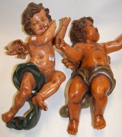 Lot 135 - A pair of reproduction resin figures of...