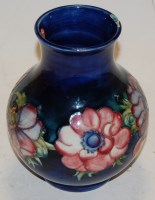 Lot 222 - A large Moorcroft pottery vase, on a deep blue...