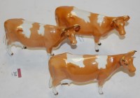Lot 265 - Three Beswick cattle; Guernsey cow first...