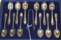 Lot 281 - A case of twelve silver teaspoons, with sugar...