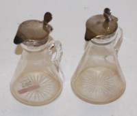Lot 287 - A near pair of Edwardian silver mounted whisky...