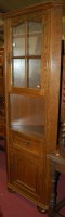 Lot 1210 - A moulded oak freestanding corner cupboard...