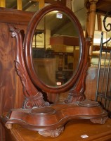 Lot 1226 - A mid Victorian mahogany oval swing mirror...