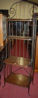 Lot 1228 - A contemporary wrought iron and oak four tier...
