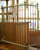 Lot 1229 - An Edwardian brass fire guard of hinged form