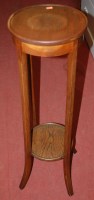 Lot 1232 - A 1930s oak circular two tier plant stand,...