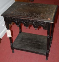 Lot 1242 - An early 20th century ebonised oak low relief...