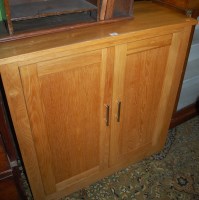 Lot 1282 - A contemporary light oak double door side...