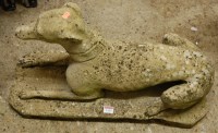 Lot 1153 - A reconstituted stone garden figure of a...