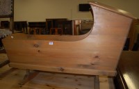 Lot 1286 - A pine baby's rocking crib, length 112cm