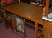 Lot 1290 - A 1980s teak rectangular dining table, raised...