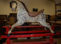 Lot 1292 - A large childs dapple-grey rocking horse,...