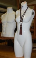 Lot 1295 - A white fibreglass female shop torso; together...