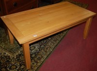 Lot 1297 - A contemporary light oak rectangular low...