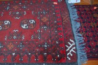 Lot 1298 - A small Persian woollen Bokhara rug; together...