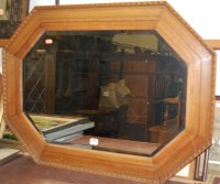 Lot 1026 - A moulded oak framed and bevelled octagonal...