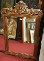 Lot 1099 - An eastern carved teak framed and bevelled...