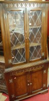 Lot 1102 - A moulded oak and lead glazed freestanding...