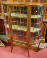 Lot 1106 - An Edwardian walnut single door lead glazed...