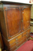 Lot 1120 - An early 19th century mahogany linenpress,...