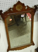Lot 1129 - A Chippendale style carved walnut wall mirror,...