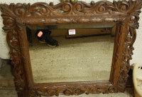 Lot 1131 - An early 20th century floral carved and...