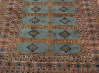 Lot 1170 - A Persian hand woven bokhara type rug having...