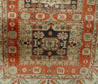 Lot 1171 - A Caucasian woollen rug, having three linked...