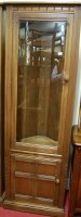 Lot 1184 - A contemporary Ercol mid elm freestanding...