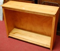 Lot 1187 - A laminate freestanding open bookshelf,...
