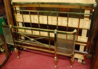 Lot 1191 - An Edwardian brass double bedstead having iron...