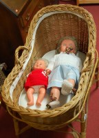 Lot 1193 - A wicker baby's crib on stand, together with...