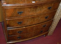 Lot 1202 - A reproduction figured walnut bowfront chest...