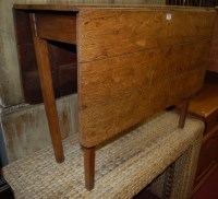 Lot 1203 - A 19th century provincial oak drop leaf...