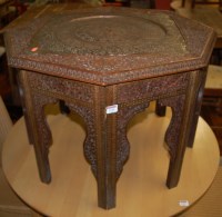 Lot 1310 - An Indian heavily floral carved low relief...