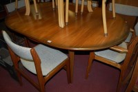 Lot 1312 - A 1970s G-Plan teak dining suite, comprising...