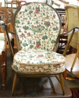 Lot 1315 - A pair of Ercol dark elm stickback open armchairs