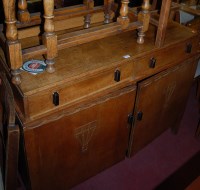 Lot 1332 - An Art Deco oak ledgeback double door...
