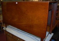 Lot 1334 - A George III mahogany dropleaf dining table,...