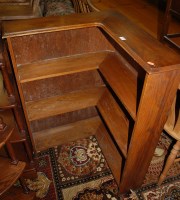 Lot 1347 - A 1930s oak open corner bookshelf