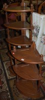 Lot 1348 - A contemporary Ercol mid-elm five tier...