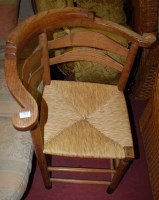 Lot 1364 - A 19th century elm and rush seat corner chair